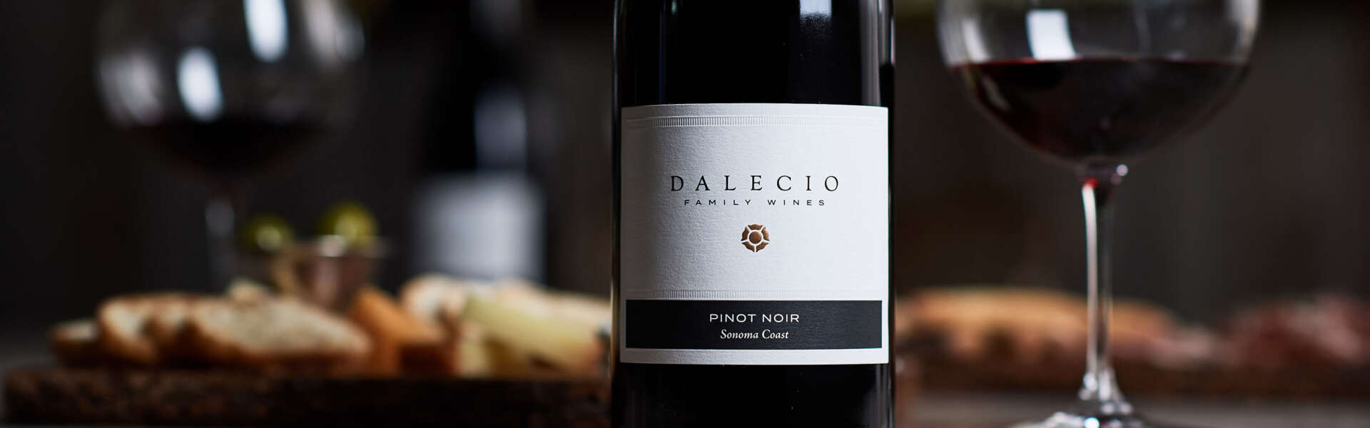 Dalecio Pinot Noir on table with glass